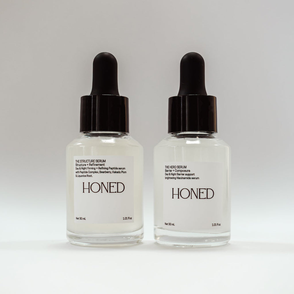 Honed Peptide and niacinamide serum daytime skincare in dropper bottles on a white background