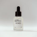 Peptide serum with bearberry, kakadu plum and liquorice root in a glass dropper bottle
