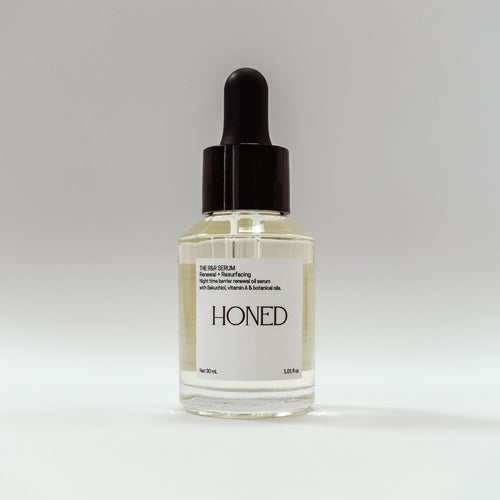 Bottle of 'Honed' skincare serum with vitamin A and Bakuchiol in a glass bottle with dropper 